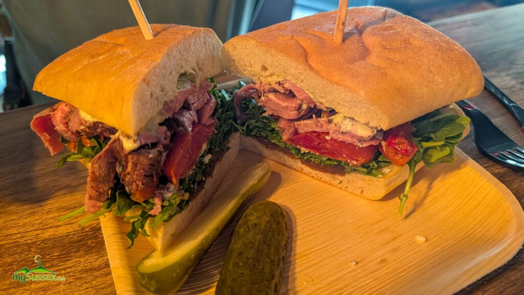 The Ranch Hand sandwich at Curd & Cleaver in Newton New Jersey, with flank steak, Gorgonzola, chimichurri aioli, arugula, tomato, and caramelized onions on ciabatta.