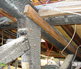 Charred attic beams inside the historic Sussex County Courthouse in Newton. The surviving timbers remain visible more than a century after the courthouse fire of 1910. Charred wooden beams visible in the attic of the historic Sussex County Courthouse in Newton, New Jersey.
