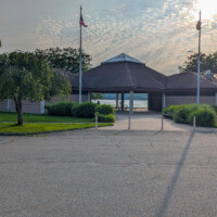 Beach facilities building with lifeguard offices, restrooms, showers, and a concession stand at Swartswood State Park.