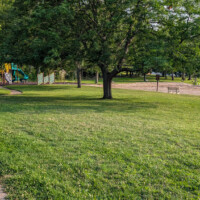 Swartswood Lake swimming area with a nearby picnic area and playground.