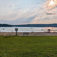 Swartswood Lake beach at sunset.