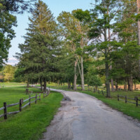 Paved road leading from the kayak rental area to the beach, picnic area, and playground at Swartswood Lake.